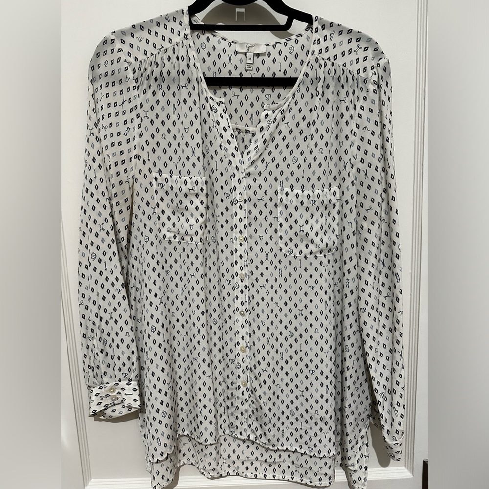 Long sleeve silk shirt with banded collar and subtle print.